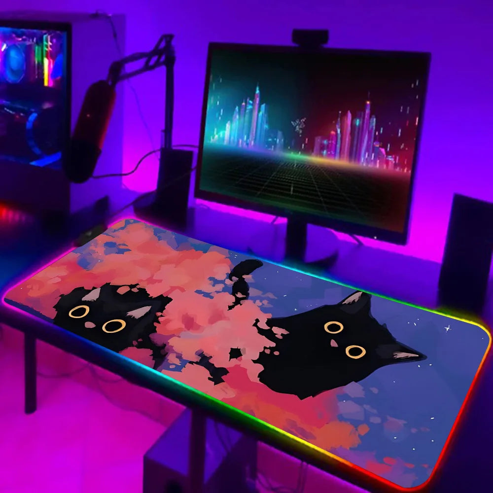 TOPTOY RGB black cat gaming mouse pad on illuminated gaming desk with colorful cat art and RGB border