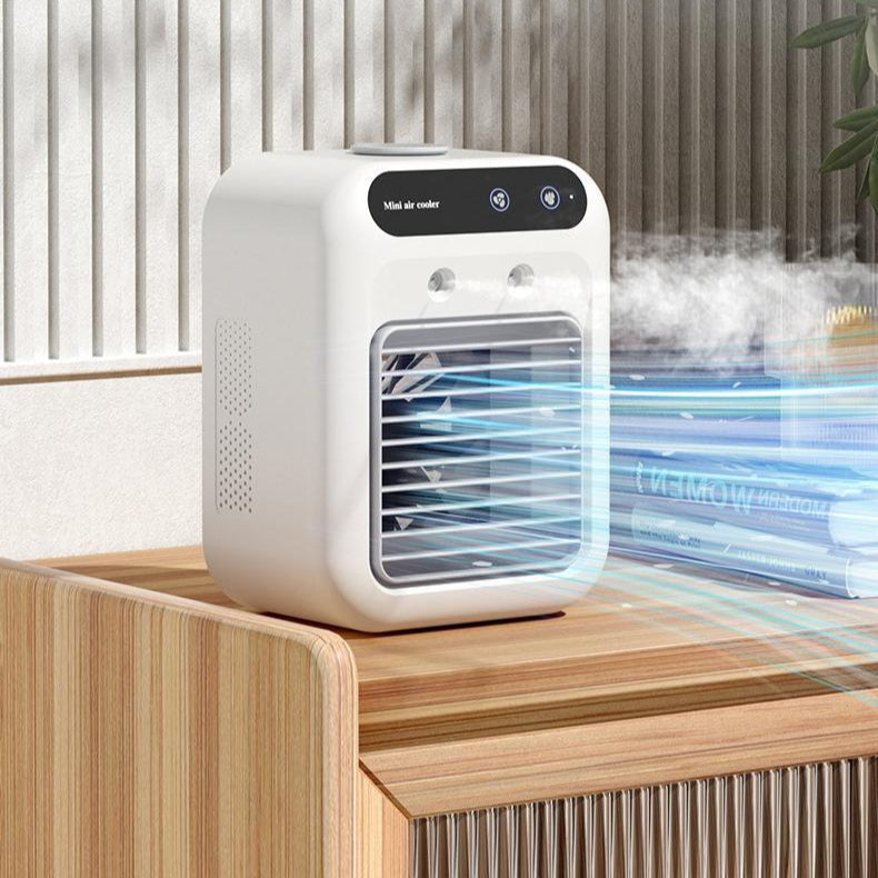 Compact white portable air cooler on wooden table emitting cool mist styled for home improvement products online
