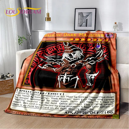 A plush throw blanket featuring a detailed Yu-Gi-Oh! 'Dark Magician' card design, draped over a white sofa in a living room setting.