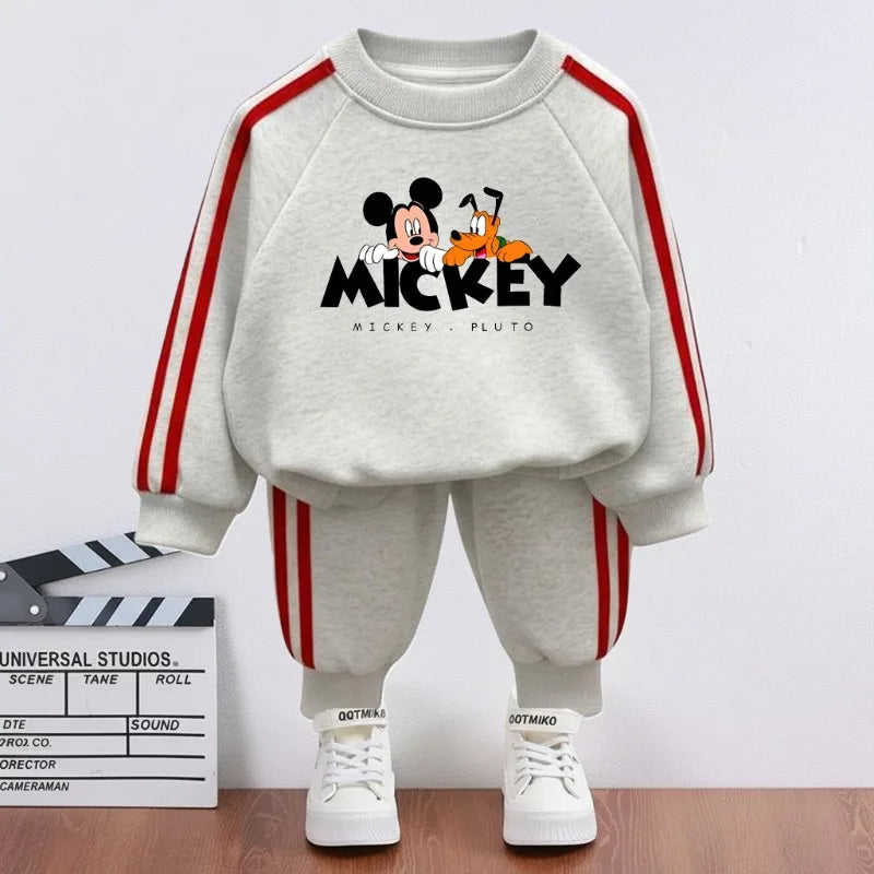 Children's outfit with Mickey and Pluto design on a white background