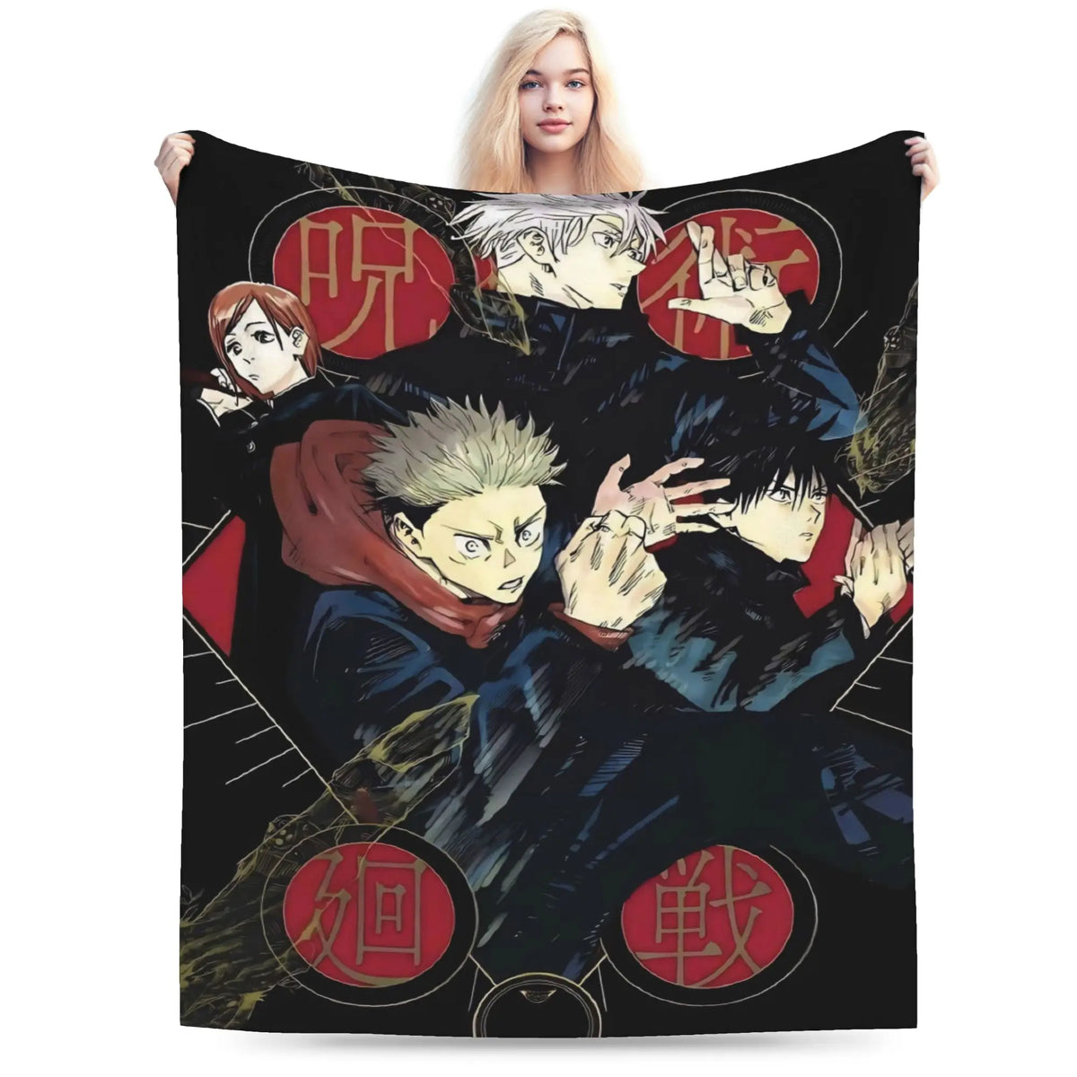 A person holds up a large black blanket or throw featuring anime-style characters and red circular motifs. The blanket is shown against a plain white studio background, with the model's hands and lower body visible behind it.