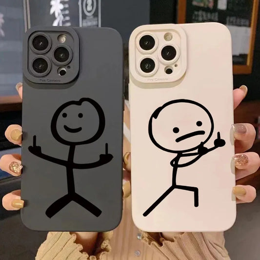 Two phone cases with stick figure designs held by a person.