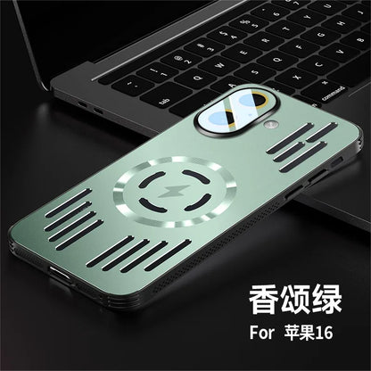 A sage green metallic magnetic phone case for iPhone 16, shown resting on a black laptop keyboard. The case features a circular magnetic center with a lightning bolt symbol, ventilation slots, and a camera cutout with a reflective lens protector.