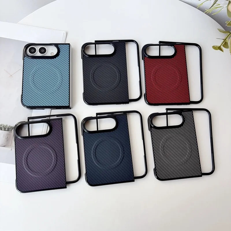 Six phone cases arranged on a white surface, each with a textured rectangular back panel and black bumper edges. The cases come in blue, black, red, purple-to-black gradient, dark blue, and dark gray-to-black gradient colorways.
