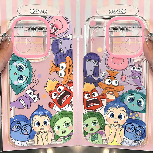 Two clear phone cases with pink camera rims and a colorful cartoon character print, held side by side with hands visible at the edges. The cases feature characters from an animated film, with pink and white striped background panels behind them.