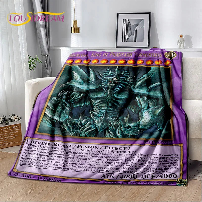 A plush throw blanket featuring a detailed fantasy illustration of a green dragon-like creature, styled on a white sofa in a modern living room setting. The blanket has a purple border with gold text and details resembling a trading card print, and the brand name 'LOUD DREAM' is visible in the top left corner.