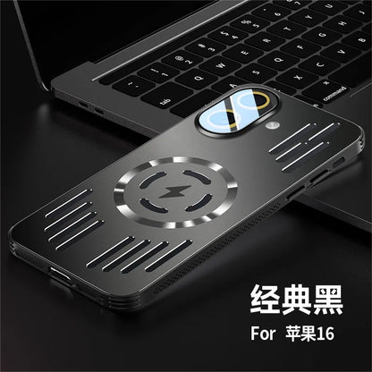 A black metallic phone case with a circular magnetic charging design and vented details, shown resting on a dark surface next to a laptop. Chinese text in the lower right reads '经典黑 For 苹果16'.