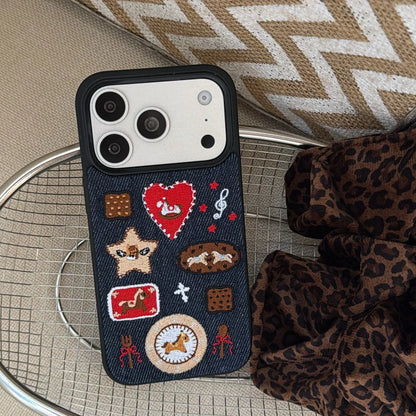 Phone case with various designs on a textured surface