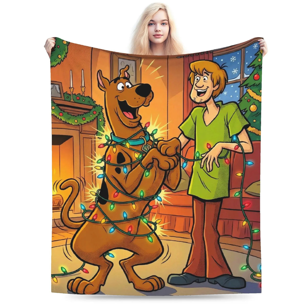 A person holds up a large printed blanket or tapestry featuring cartoon characters Scooby-Doo and Shaggy wrapped in Christmas lights, shown against a plain white background.