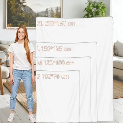 A woman stands beside a large white bedding set displayed in four sizes with printed size labels: XL 200*150 cm, L 150*125 cm, M 125*100 cm, and S 102*76 cm. The setting appears to be a bright living room with a sofa, rug, and framed wall art in the background.