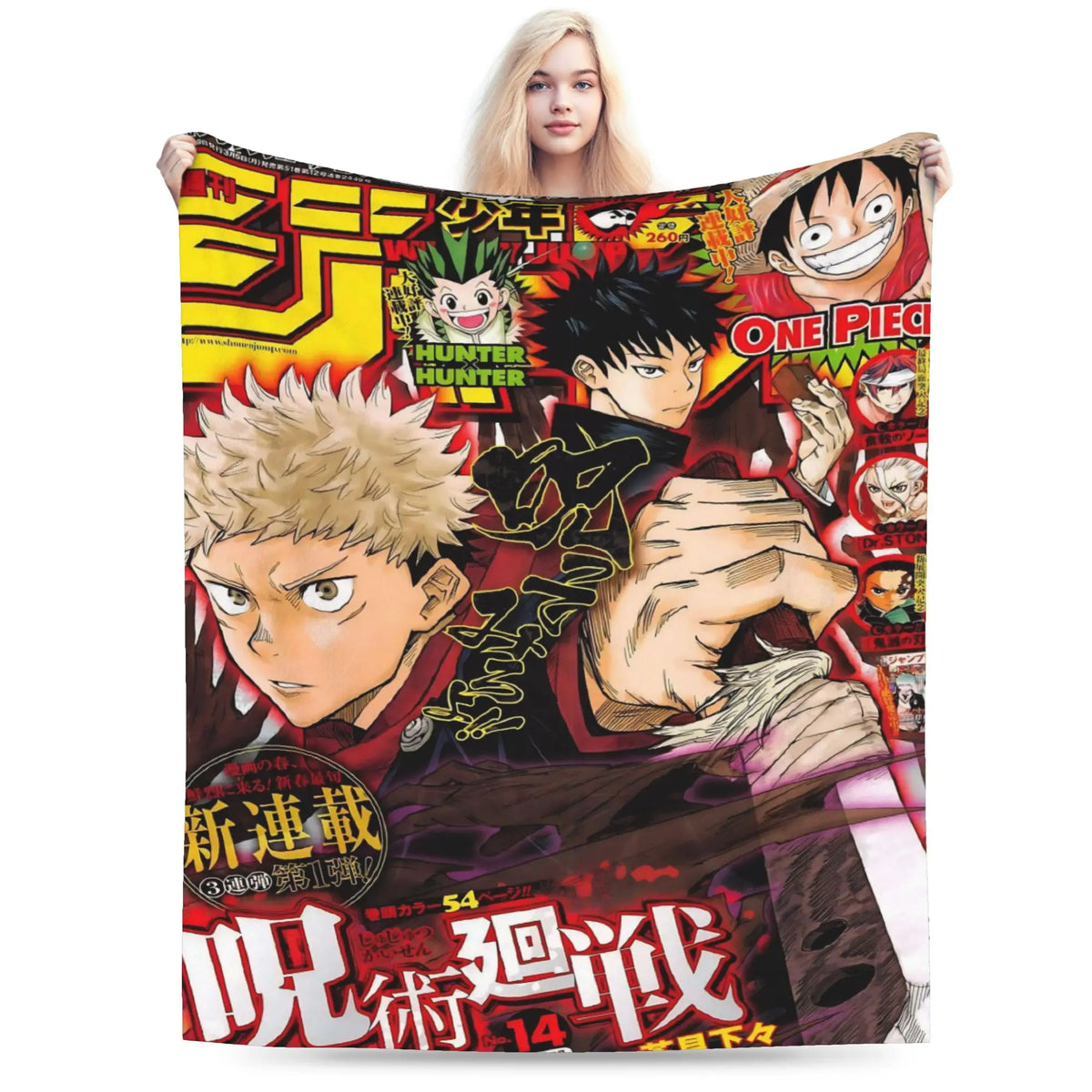A woman holds up a large printed blanket or throw featuring anime-style characters and bold Japanese text. The blanket has a busy collage design with multiple characters, including One Piece and Hunter x Hunter, in red, black, yellow, beige, and white tones.