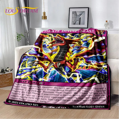 A colorful plush blanket featuring a vibrant Yu-Gi-Oh! Cobra Battle card design, draped over a white sofa in a living room setting.