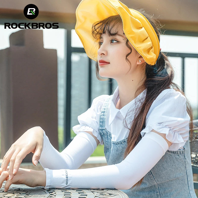 Woman wearing a yellow hat and white long-sleeve shirt with 'Rockbros' branding.