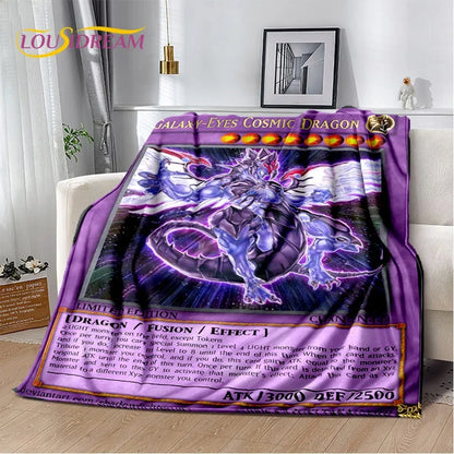 A plush throw blanket featuring a purple and blue 'Galaxy-Eyes Cosmic Dragon' anime-style illustration, styled draped over a white sofa in a living room setting.
