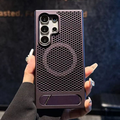 Hand holding a phone case with honeycomb design and brand logo.