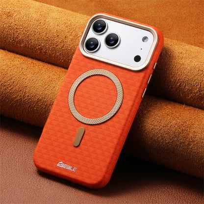 Orange phone case with metallic ring on a brown textured background