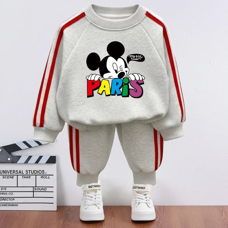 Children's outfit with cartoon character and 'Paris' text on a white background