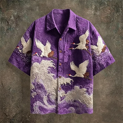 Purple shirt with crane and wave design on a textured brown background