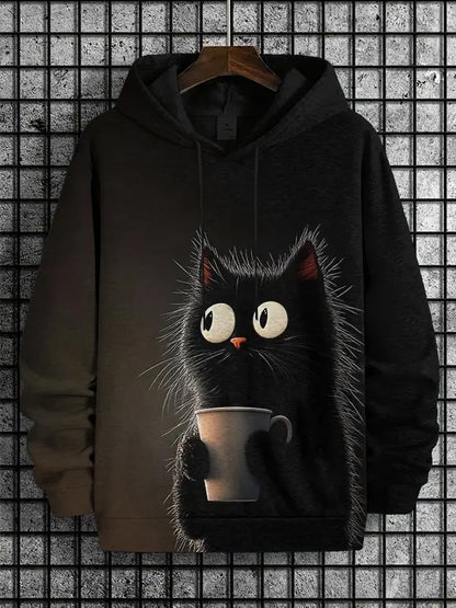 Black hoodie with a cat holding a coffee cup design on a textured wall background