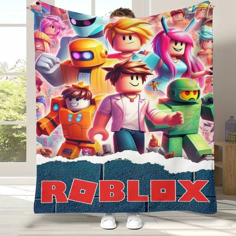 A person holds up a large Roblox wall tapestry featuring colorful cartoon characters and the Roblox logo at the bottom, shown in a bright room setting.