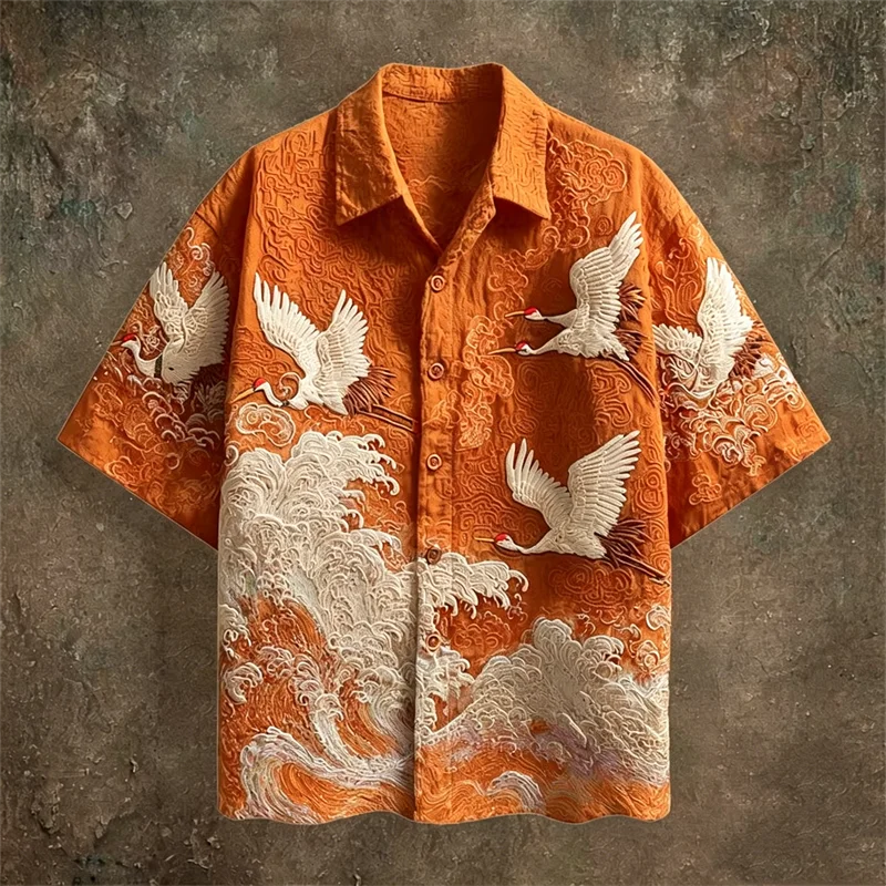 Orange shirt with white crane and wave patterns on a textured brown background