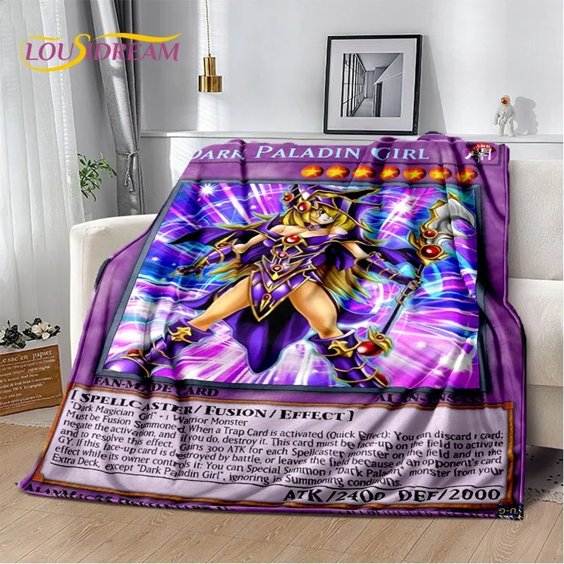 A plush throw blanket featuring Yu-Gi-Oh! 'Dark Paladin Girl' artwork, styled draped over a white sofa in a modern living room setting.
