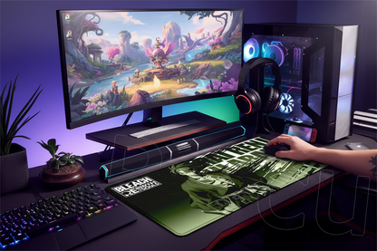 Gaming setup with monitor, keyboard, mouse, and mouse pad on a desk.