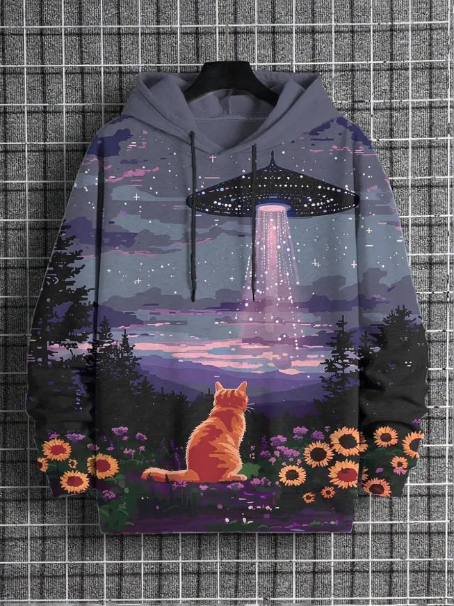 Hoodie with a design of a cat sitting in a field of flowers under a UFO and rainbow, on a grid background.