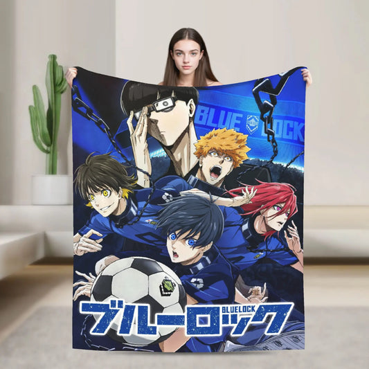 A woman holds up a large Blue Lock anime blanket featuring characters including Kenma, Riko, and Tetsurou in blue soccer uniforms, with the Blue Lock logo at the bottom.