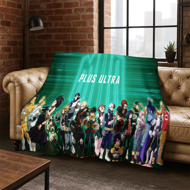 A fleece throw blanket featuring characters from the anime series My Hero Academia, draped over a tan leather sofa in a modern living room setting with a brick wall and window.