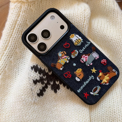 Phone case with embroidered designs on a knitted fabric background