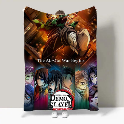 A person holds up a large blanket or poster featuring the Demon Slayer: Infinity Castle anime artwork, with the text 'The All-Out War Begins' and character portraits along the bottom. The scene is photographed against a plain light gray wall.