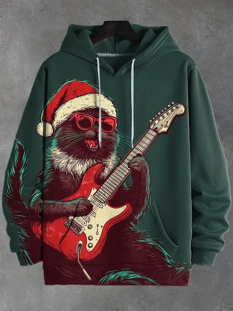 A dark green pullover hoodie featuring a large graphic print of a cartoon cat wearing a red Santa hat and red sunglasses while playing a red electric guitar. The hoodie is shown hanging on a black hanger against a textured gray background.