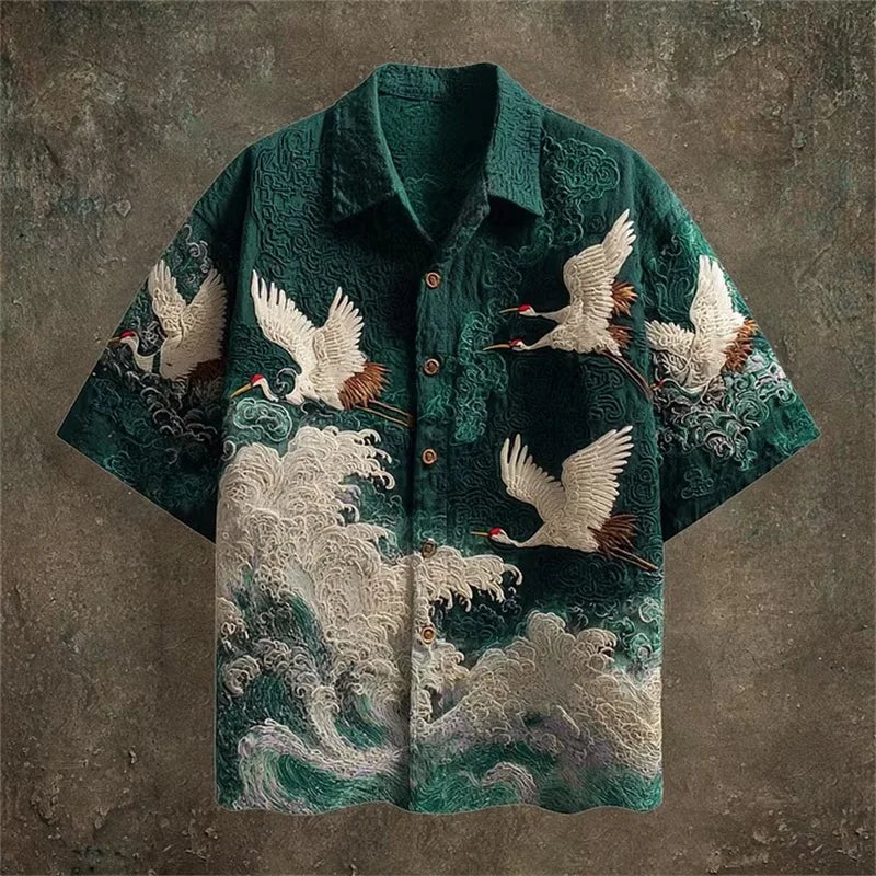 Green shirt with crane and wave design on a textured brown background