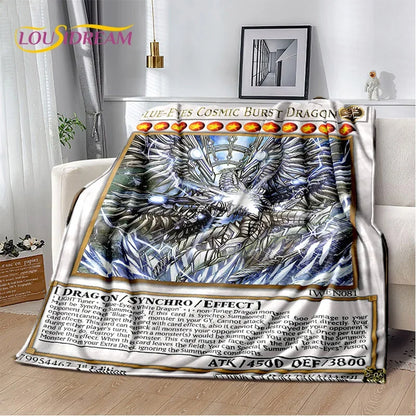 A plush throw blanket featuring a detailed graphic of a blue-eyed cosmic burst dragon, styled on a white sofa in a living room setting.
