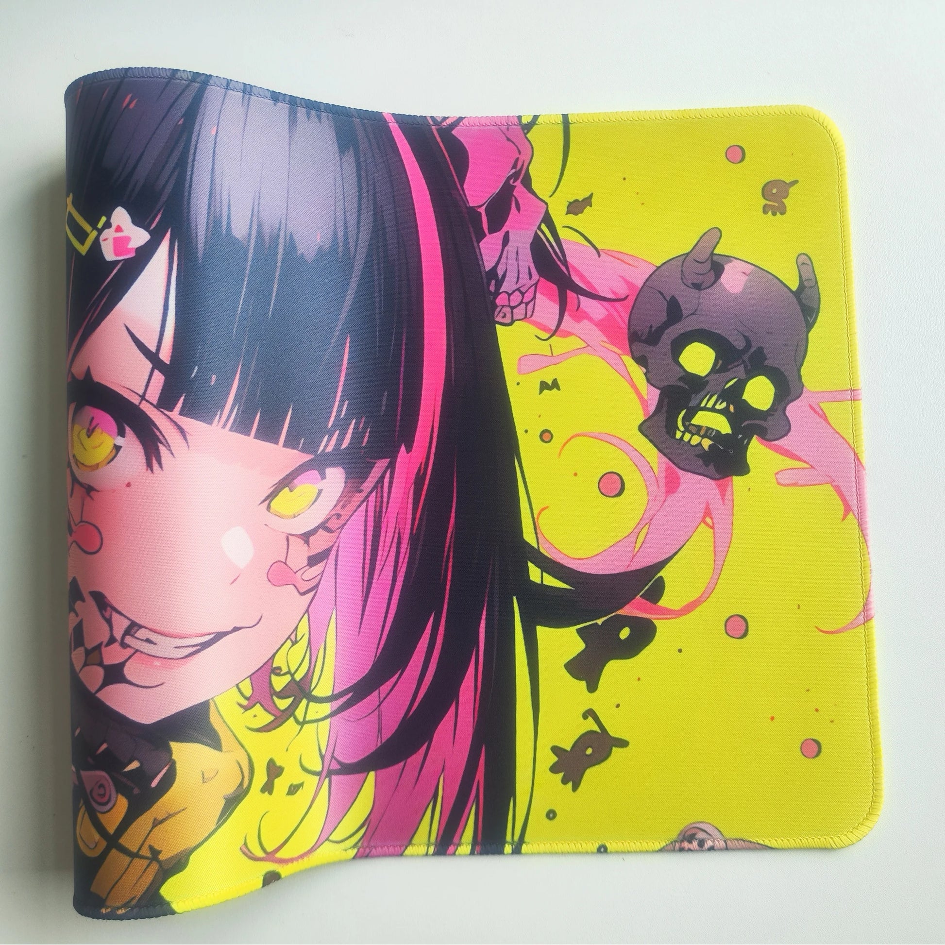 Bellissimo kawaii anime girl mouse pad featuring pink haired girl with yellow eyes and skull graphics