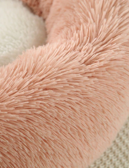 Teal Zeus blush pink donut plush pet bed for cats and small dogs with soft faux fur texture and cream center