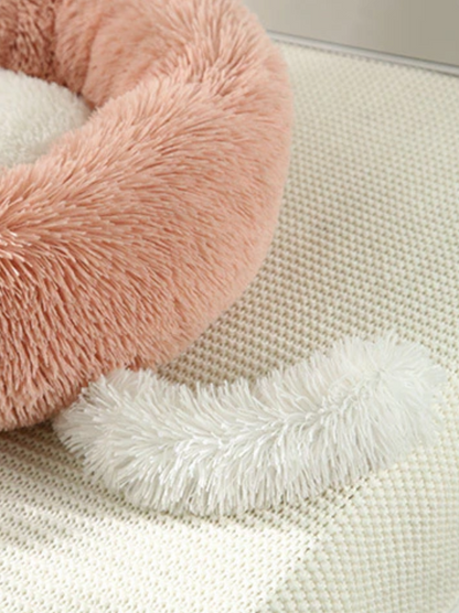 Teal Zeus blush round plush pet bed for cats and small dogs with faux fur donut design on cream mat