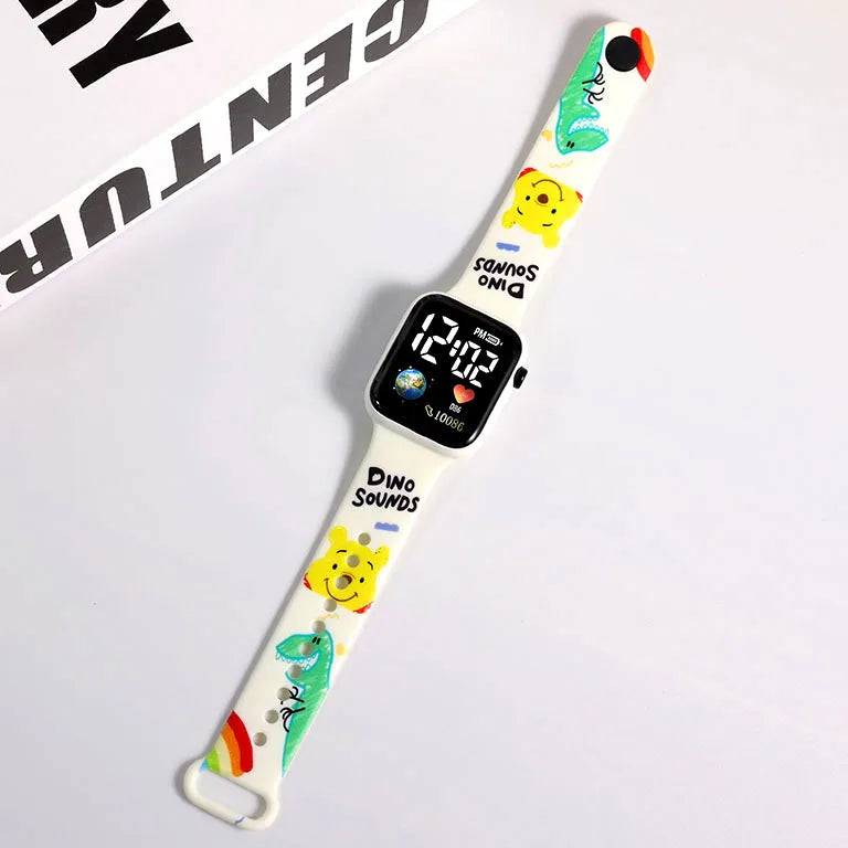 MINISO white smartwatch band with colorful dinosaur and bear prints showing Hello Kitty digital watch for girls
