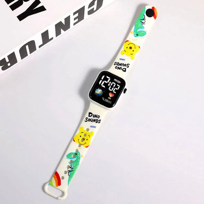 MINISO white smartwatch band with colorful dinosaur and bear prints showing Hello Kitty digital watch for girls