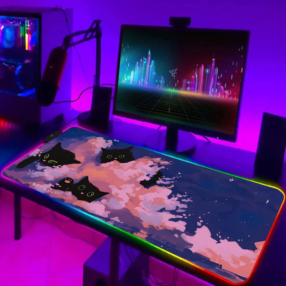 TOPTOY RGB black cat gaming mouse pad on extended desk with RGB border and neon gaming setup